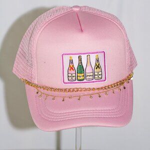 Pink "Champagne" trucker hat with gold hat jewelry